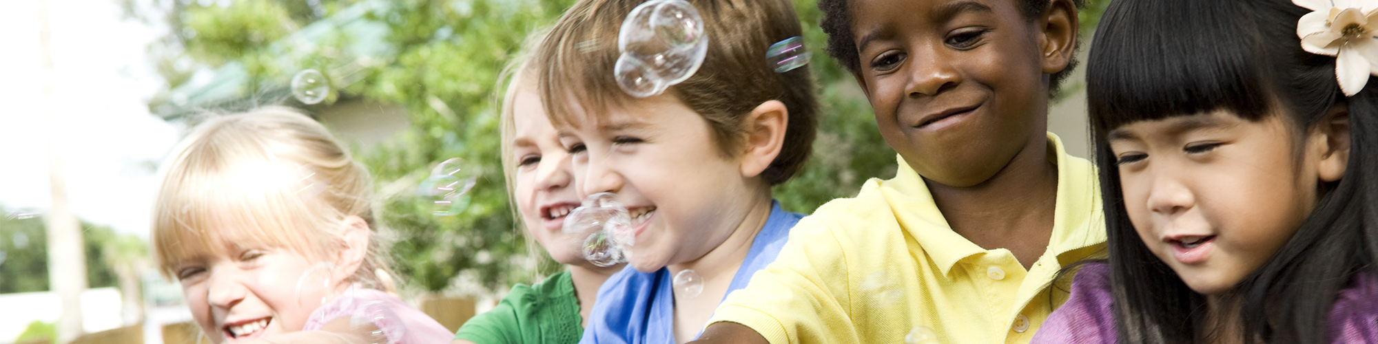 Children Playing With Bubbles